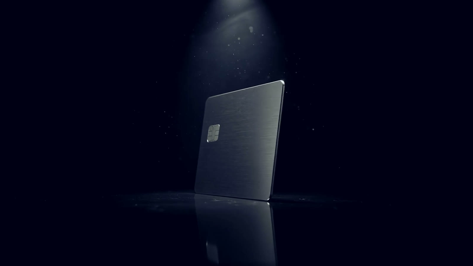A metal card under a single spotlight